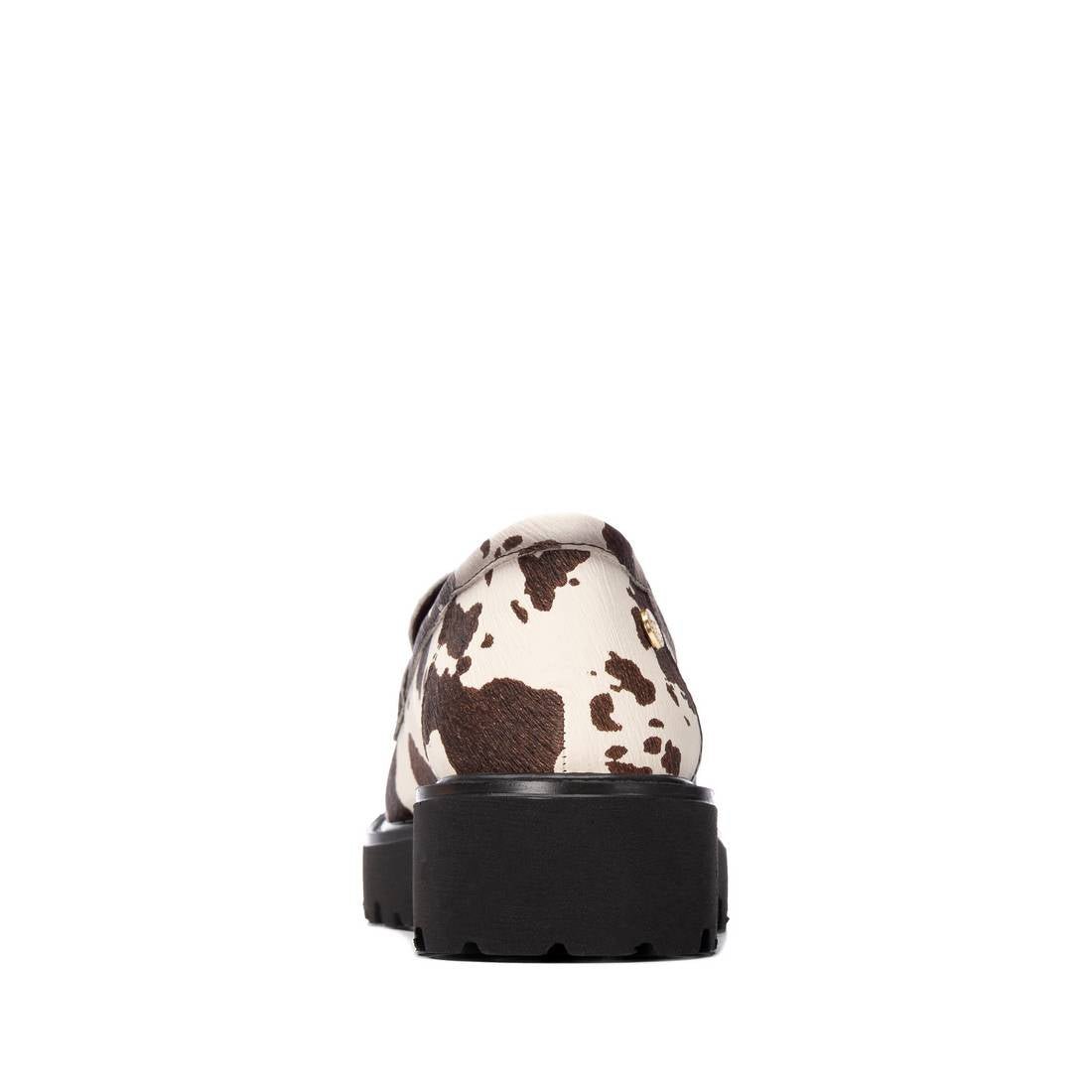 Mocassim XTi padrão vaca visto por trás, com sola plataforma preta